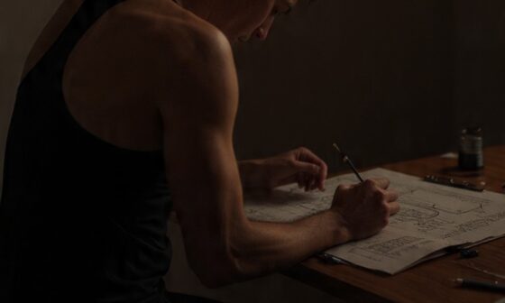 A person practicing their craft alone in soft light, symbolizing the discipline, focus, and steady progress that come from deliberate practice.