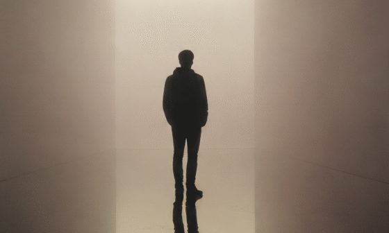 A person standing before a foggy mirror that clears to reveal a calm reflection, symbolizing humility, self-awareness, and clarity beyond ego.