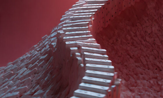 An abstract concept illustration of a person on a steep slope made of dominoes, representing the chain reaction of the slippery slope fallacy.