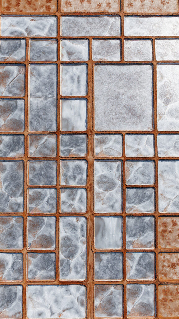 Aerial view of geometric salt evaporation ponds reflecting sunlight, symbolizing systematic effort distribution and maximizing impact.