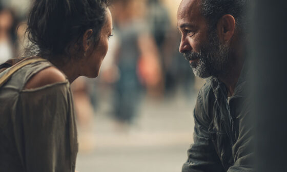 A person showing kindness to another without expectation, symbolizing character revealed through everyday treatment of others