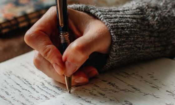 Man writing in journal for cognitive clarity