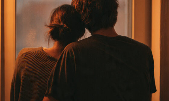 A couple sharing a quiet, supportive moment together